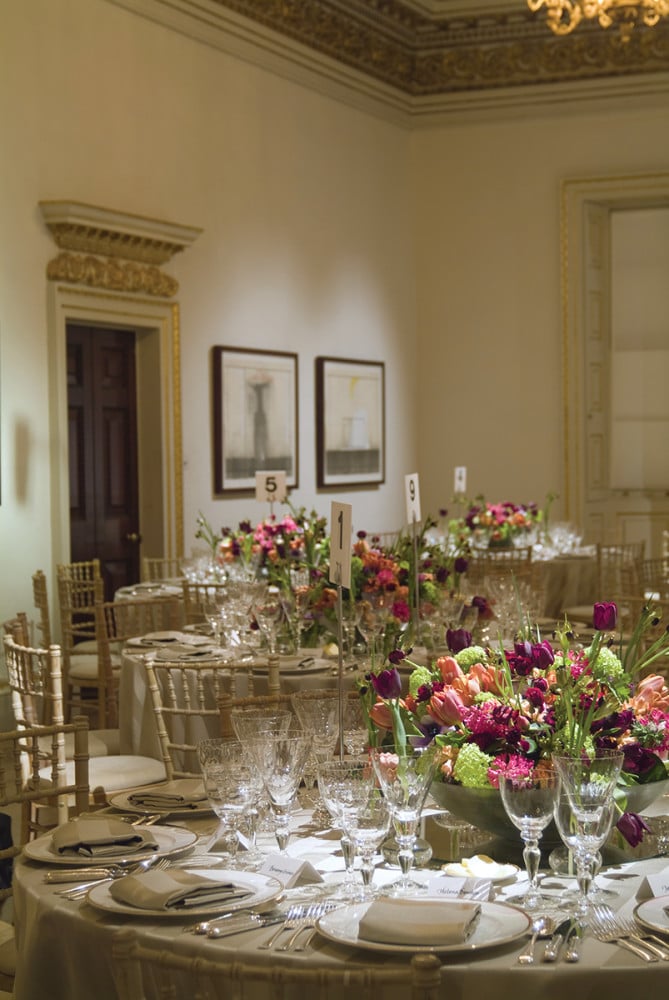 For an event at one of London's leading museums, Connolly created low centerpieces of electric-hued spring blooms in low bowls. (Photo Courtesy of Shane Connolly LLP)