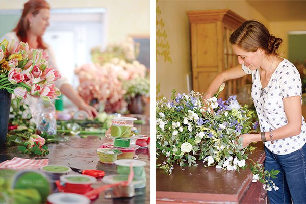 Left: Tables strewn with rolls of ribbon and buckets of flowers await workshop participants. | Right: Erin Benzakein works on creating a pleasing cascade for an arrangement.
