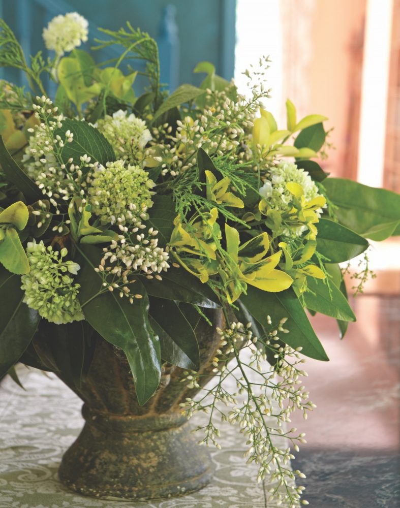 Green and white flower arrangement made by Margot Shaw for a fall brunch