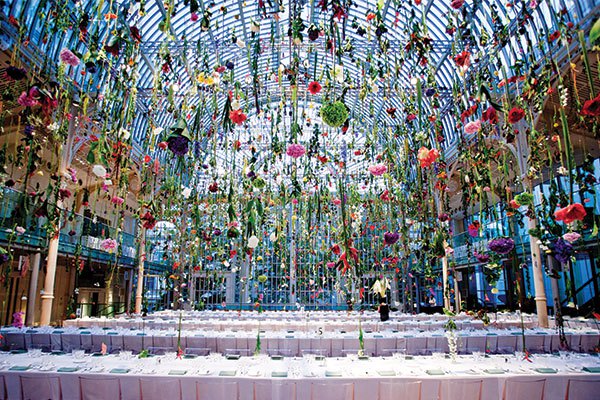 Garden blooms dangled from the glass ceiling of the Floral Hall inside the London Royal Opera House for the Ballet and Banquet affair hosted by Hermès. Photo courtesy of Rebecca Louise Law