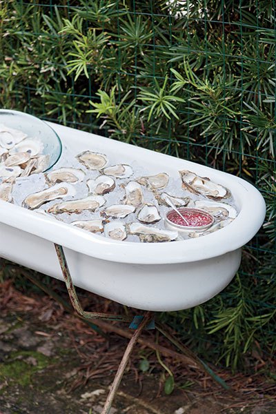 Oysters on the half shell are served from a vintage Danish bathtub.
