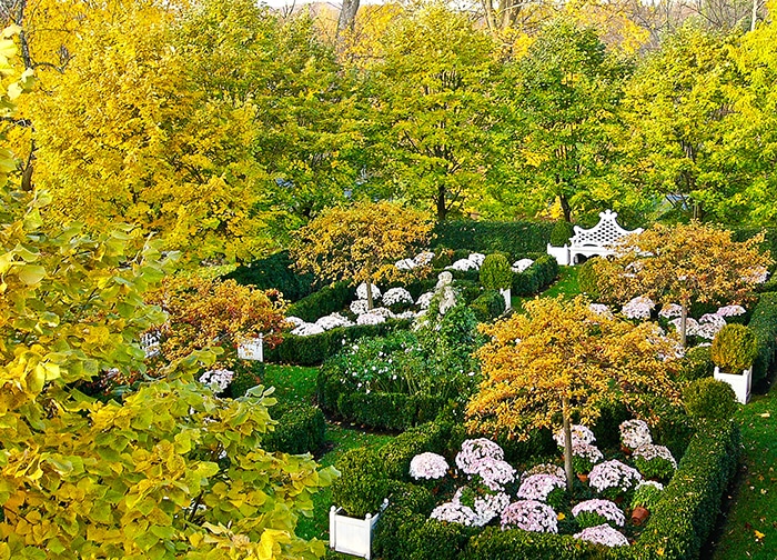 An elevated view of a grid of garden rooms at the home of Carolyne Roehm