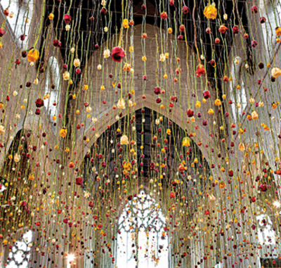 In Rebecca Louise Law’s 3,000-flower installation in London’s Garden Museum, roses rained down from the cathedral ceiling. Photo cour- tesy of Rebecca Louise Law.