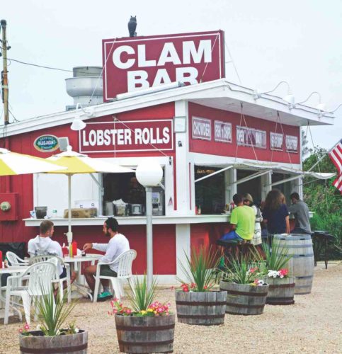 Clam Bar with people sitting at counter and outdoor tables