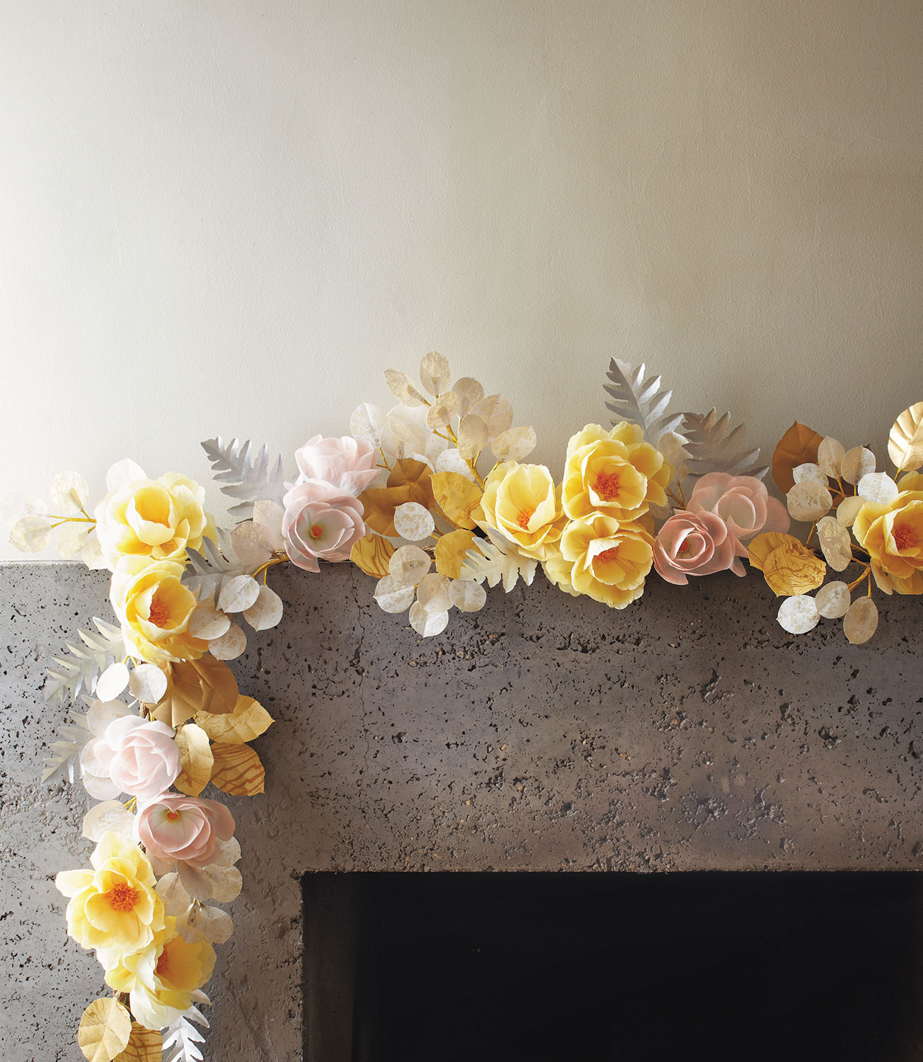 pale yellow, pink, and white garland of paper flowers