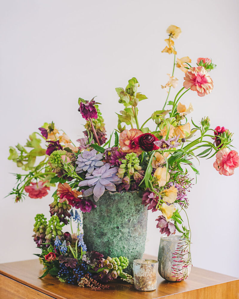 Connected two-piece floral arrangement with succulents designed by Susan McLeary