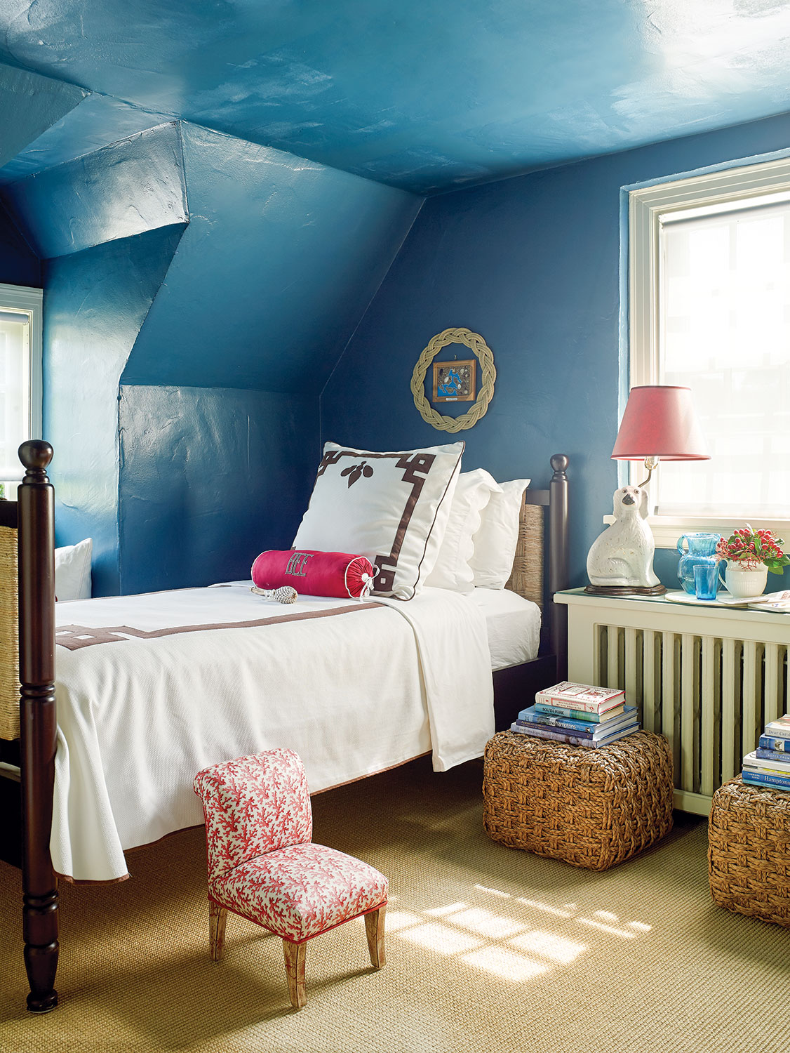 Guest room walls in Benjamin Moore’s Galapagos Turquoise in a high-gloss finish.