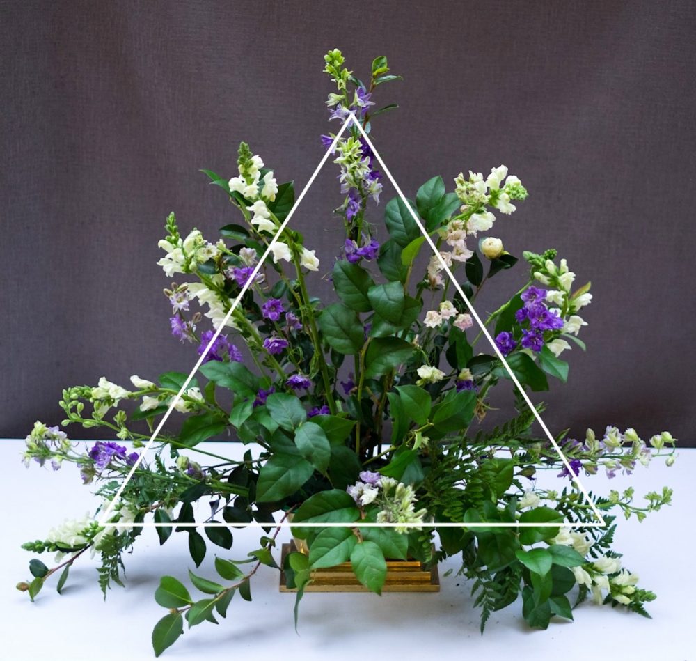 classic triangle church flower arrangement