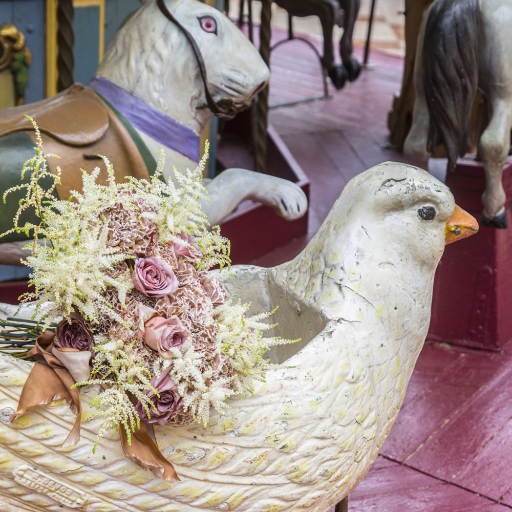 Laura Dowling bouquet on a Parisian carousel pigeon 
