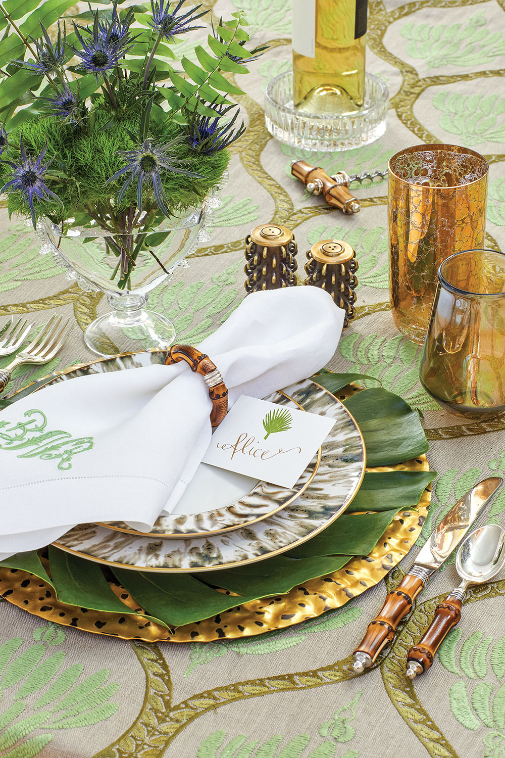 When it’s too hot outside, bring the tropics to your table by mixing hues of sunshine gold with cool, leafy greens and natural bamboo