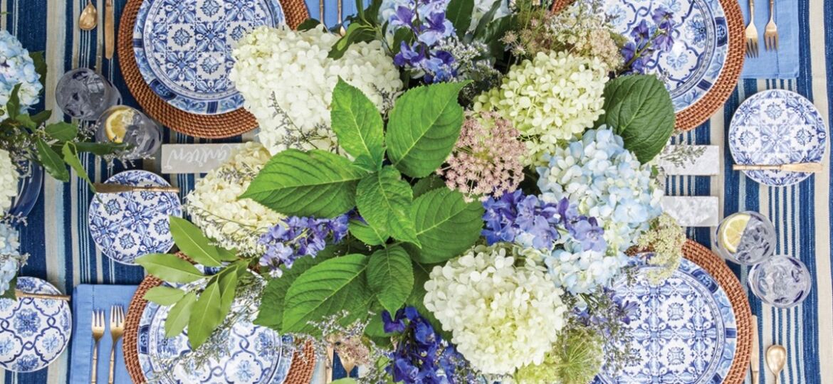 hydrangea flowers arranged on a blue and white table