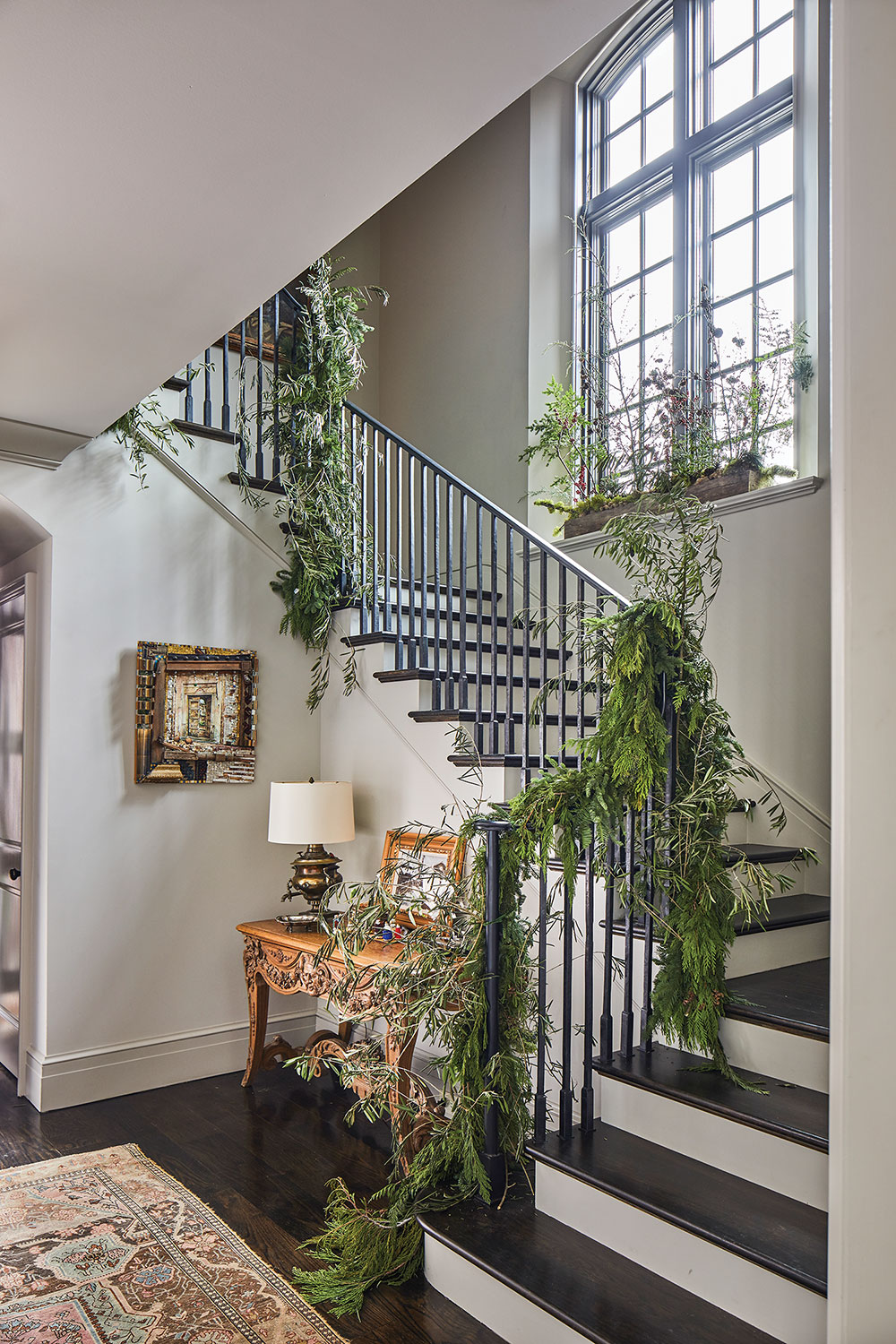 stair rail decked in greenery