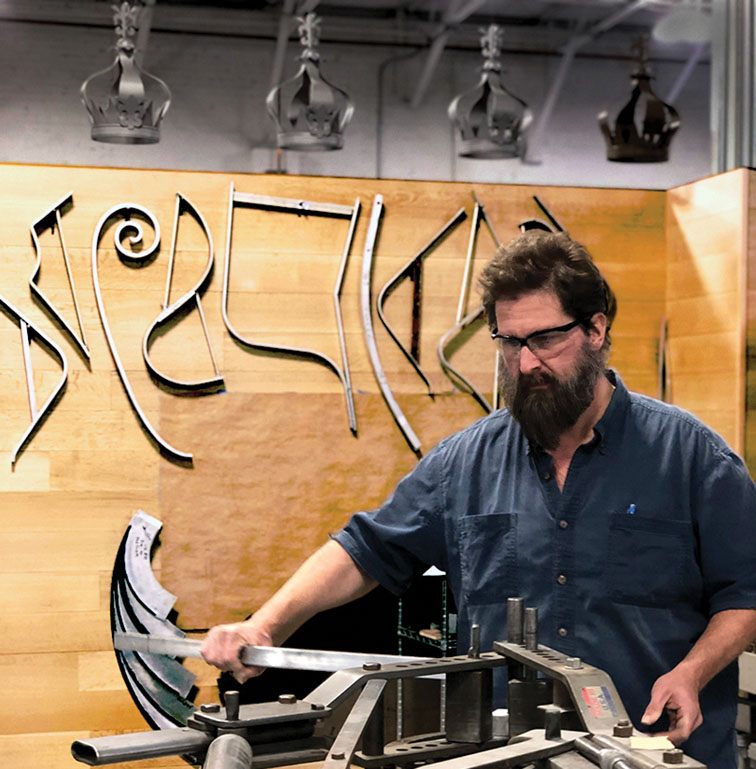 An artisan creates furniture at McKinnon and Harris in Richmond, Virginia