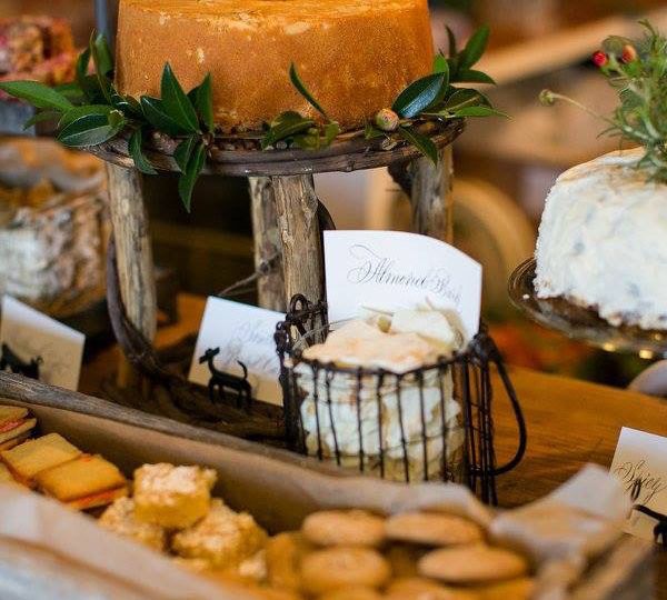 A holiday spread, including almond bark, pound cake, and other sweet and savory treats