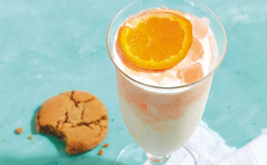 Orange and cream cocktail served with a Five-Spice Gingersnap