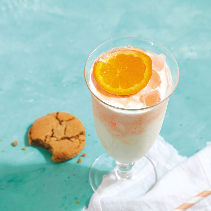 Orange and cream cocktail served with a Five-Spice Gingersnap