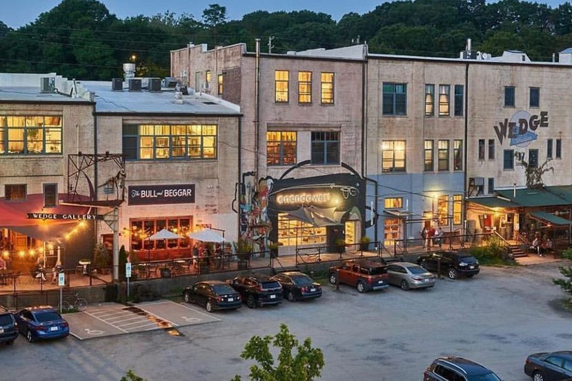 Best shopping in Asheville, NC: Street scene of a row of funky shops, including The Wedge, in River Arts District 