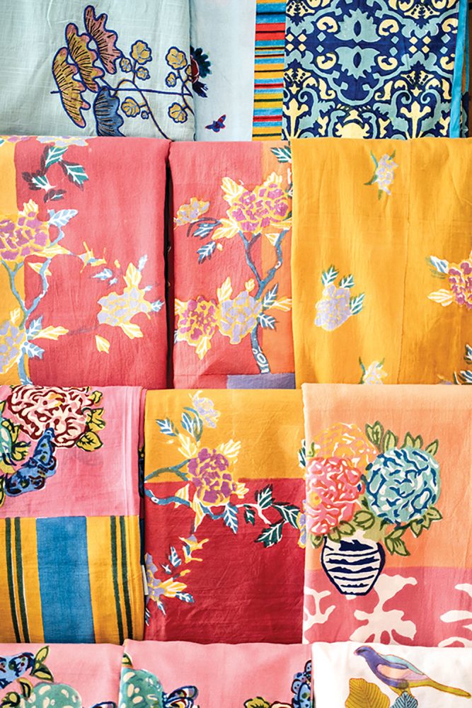 linens in an assortment of patterns, including florals, birds, and batiks