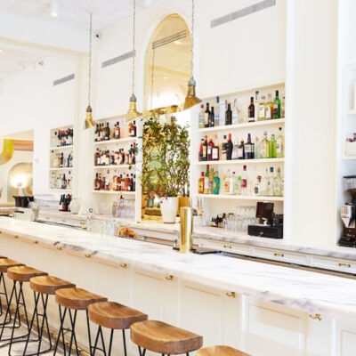 long marble bar inside Il Florista, a new restaurant in New York City