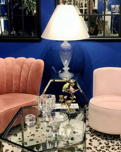 Scene from Maison & Objet 2020: A deep blue wall sets off a mauve sofa and pale pink chair with curved modern lines