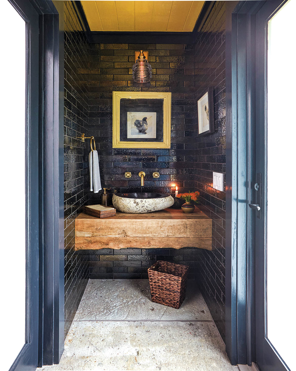 Blue tiled powder room in old stable that has been converted to a space for entertaining.