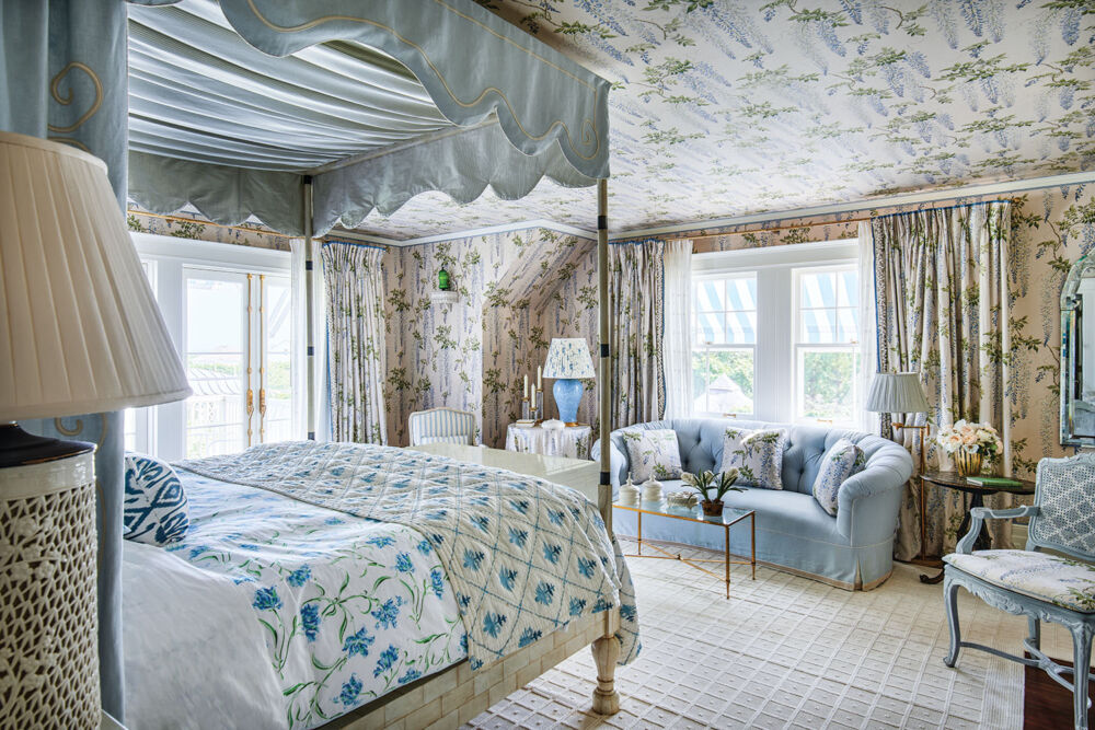 Blue florals cover Liz Lange's bedspread, walls, and ceilings in her bedroom.