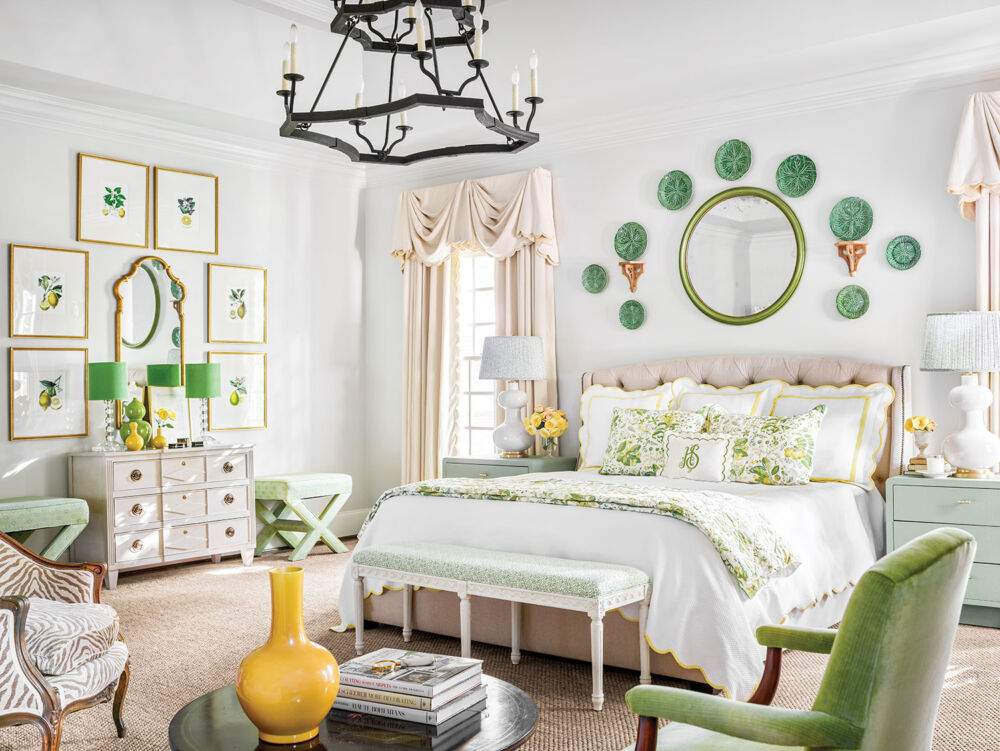 White bedroom has green accents all around.