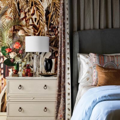 Bed and bedside table in Tish Mills designed guest bedroom. Canaan Miller florals on table.
