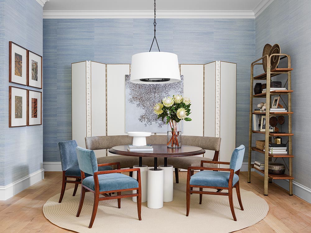Game table with banquette and blue chairs, etagere, and folding screen in Ray Booth designed family room at the Flower Atlanta Showhouse