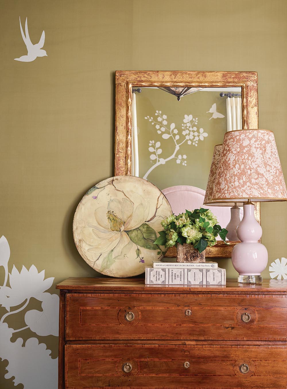 Dresser in girl's bedroom at the FLOWER Atlanta showhouse, pink lamp, round painting of magnolia blossom.