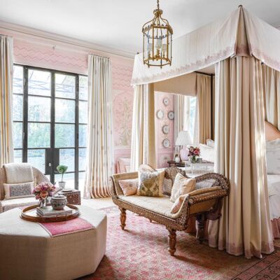Canopy bed and sitting area in primary bedroom designed by Cathy Kincaid for the Flower Atlanta Showhouse.