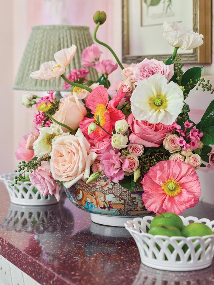Chinese bowl with pink and white flower arrangement in Cathy Kincaid's primary bedroom.