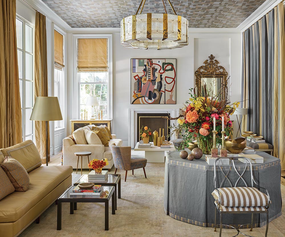 FLOWER Atlanta Showhouse salon with abstract painting over fireplace, wallpapered ceiling, and flower arrangement by Sybil Sylvester.