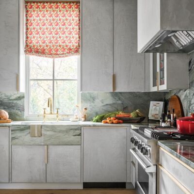 Catering kitchen with a gray plaster pastellone finish from Domingue that covers the Kingdom Woodworks cabinetry, ceiling, walls, and hood. Room designed by Melanie Millner.
