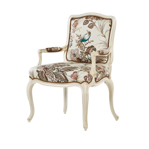 White finish Theodore Alexander chair upholstered with floral fabric.