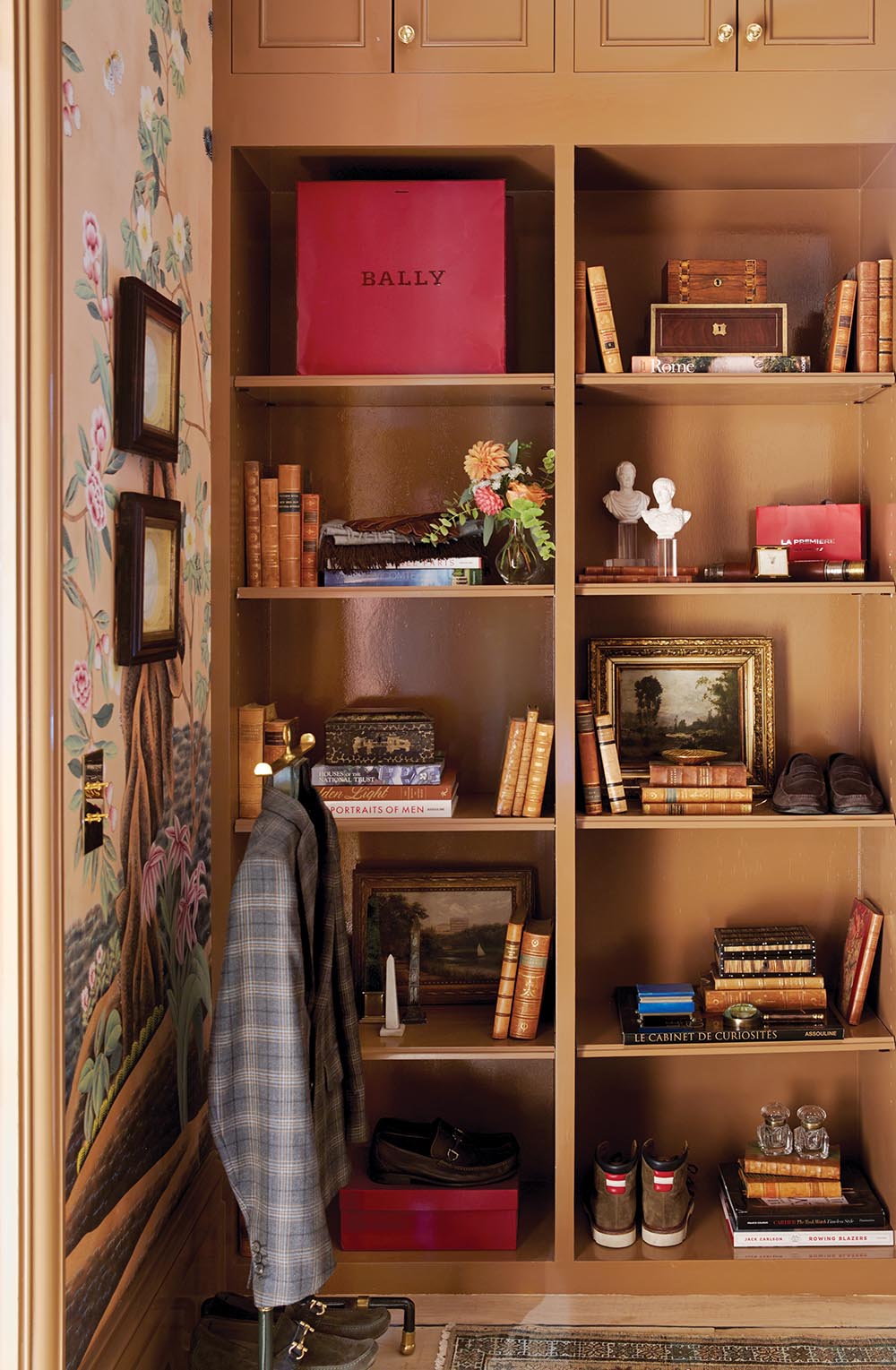 Open shelves in gentleman's dressing room designed by Nina Long and Don Easterling.