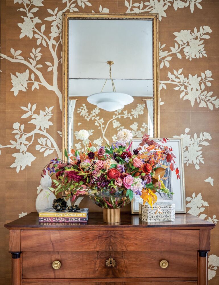 Chest topped with flowers by Pick-a-Petal in the Lisa Palmer designed bedroom at the Flower magazine Baton Rouge showhouse