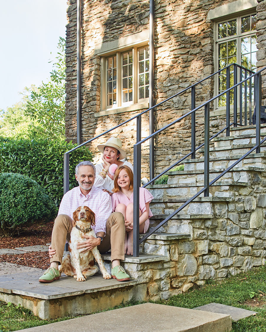 family of Landscape Architect Gavin Duke, sitting on the stone steps of their Nashville home