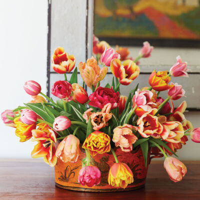 A simple tulip arrangement by floral designer Mimi Brown in a tole cachepot