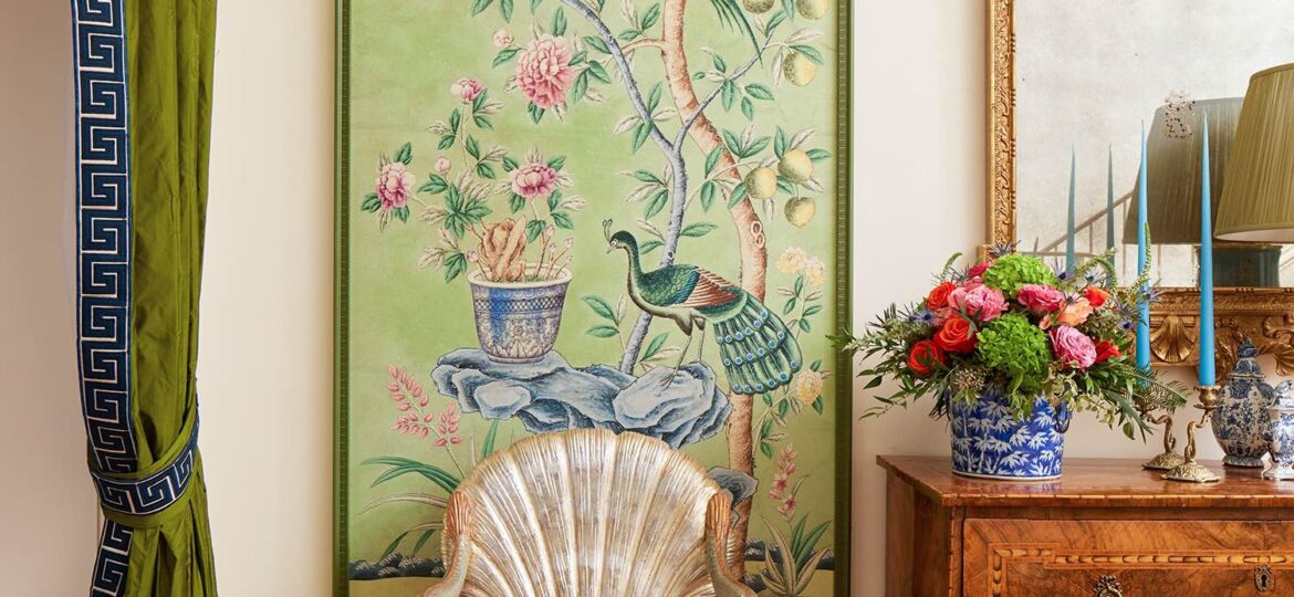 Shell shaped chair in front of framed wallpaper panel on terrace level landing designed by Jared Hughes at the Flower Magazine Showhouse