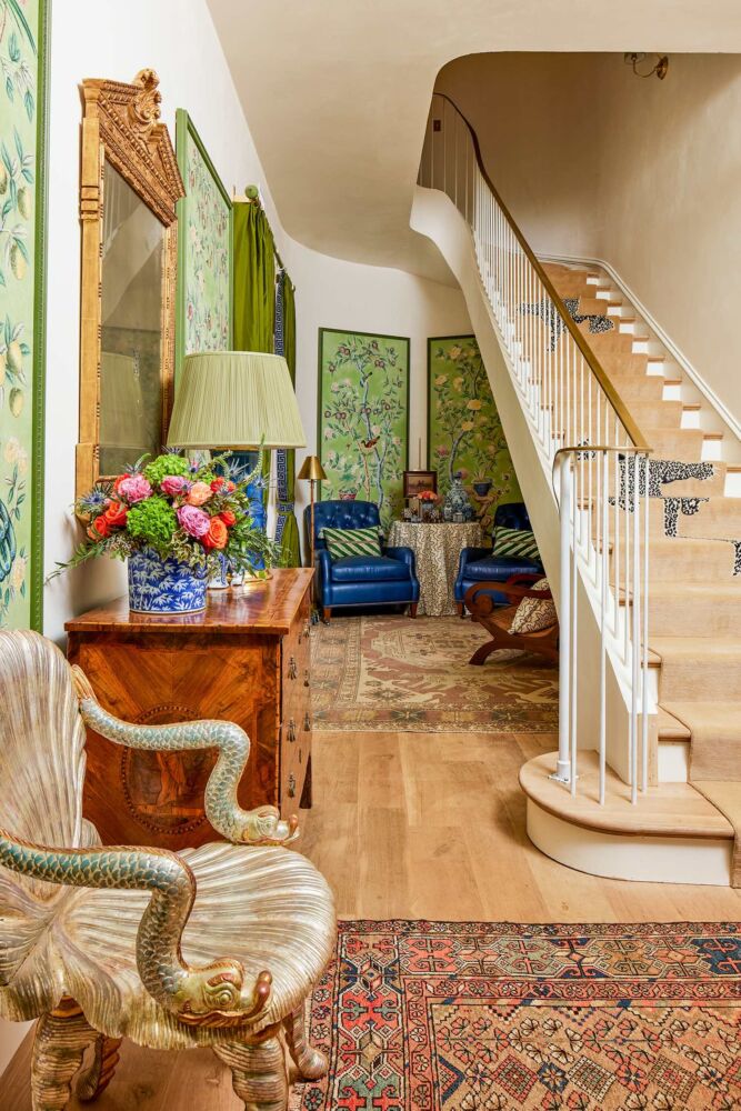 Terrace-level sitting area under the stairs designed by Jared Hughes at the Flower Atlanta showhouse