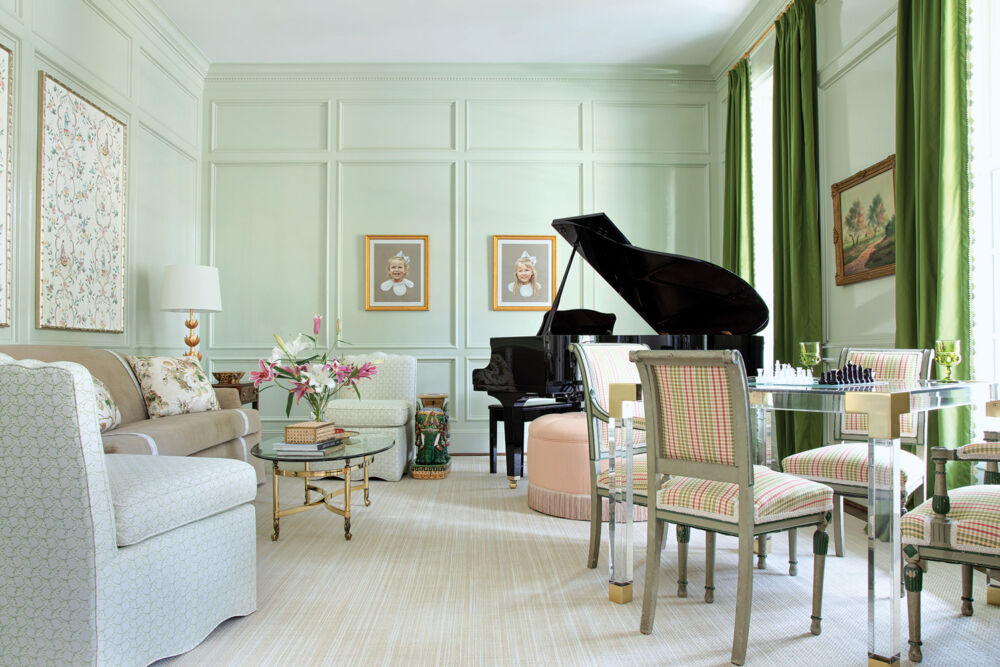 A pale green wall lights up a bright and cheery music room.