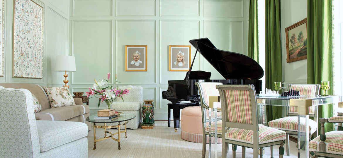 A pale green wall lights up a bright and cheery music room.