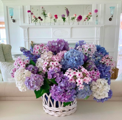 Floral arrangement by Cathy Graham, featuring purple, pink, blue and white spring flowers