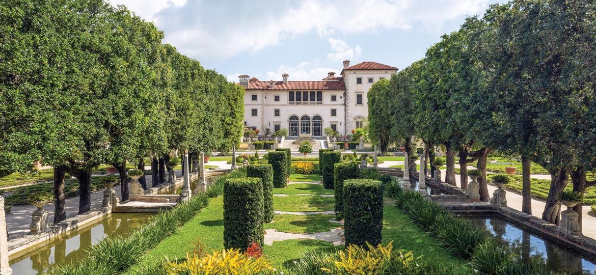 The green grounds of Vizcaya open up to Spanish Mansion.