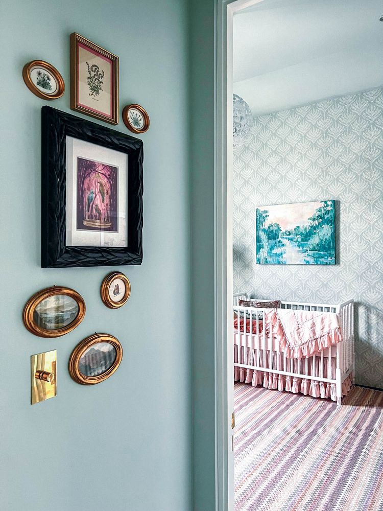 A teal doorway opens up to a sweet nursery.