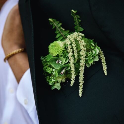 Green pocket square boutonniere