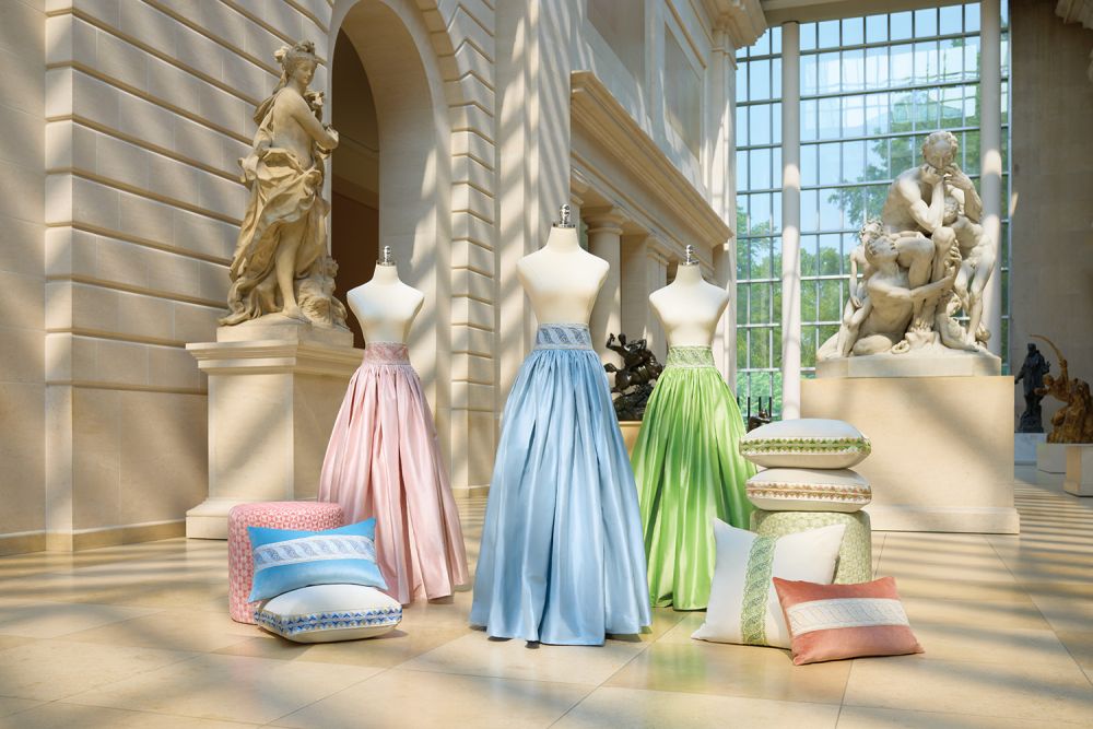 Blue, pink, and green Scalamandré floor length skirts on mannequins.