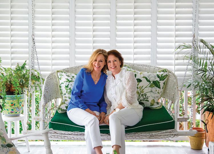 portrait of the founders of the skincare line Sapelo sitting together on a porch swing