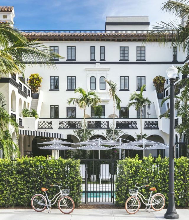 bikes in front of hotel with Spanish-style architecture